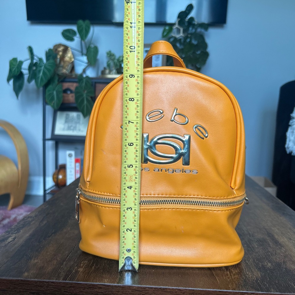 Bebe Kayla Small Backpack Women OS Apricot Orange NWT Faux Leather Mini Bag Logo - Picture 7 of 7